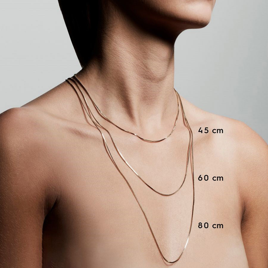 NANCY necklace 50 cm silver-plated on a woman's neck, showcasing its simple, stylish design ideal for layering with other Pilgrim chains.