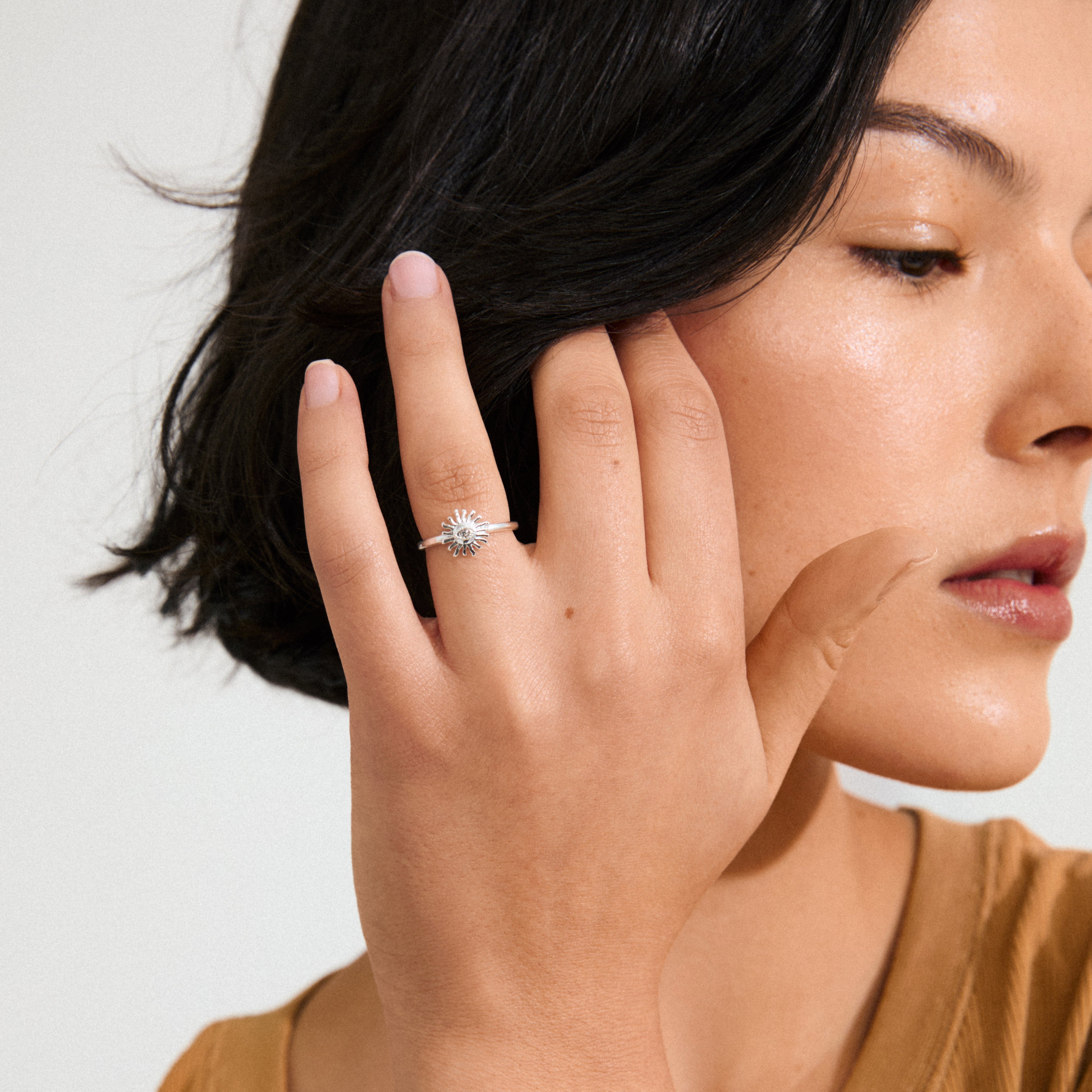 LULU sun stack ring silver-plated from Pilgrim, featuring a radiant sun design with a central crystal eye, perfect for a unique, stylish statement.