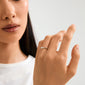 Close-up of a woman's hand wearing the silver-plated Lulu Mom stack ring, showcasing its elegant and simple design as a tribute to mothers.