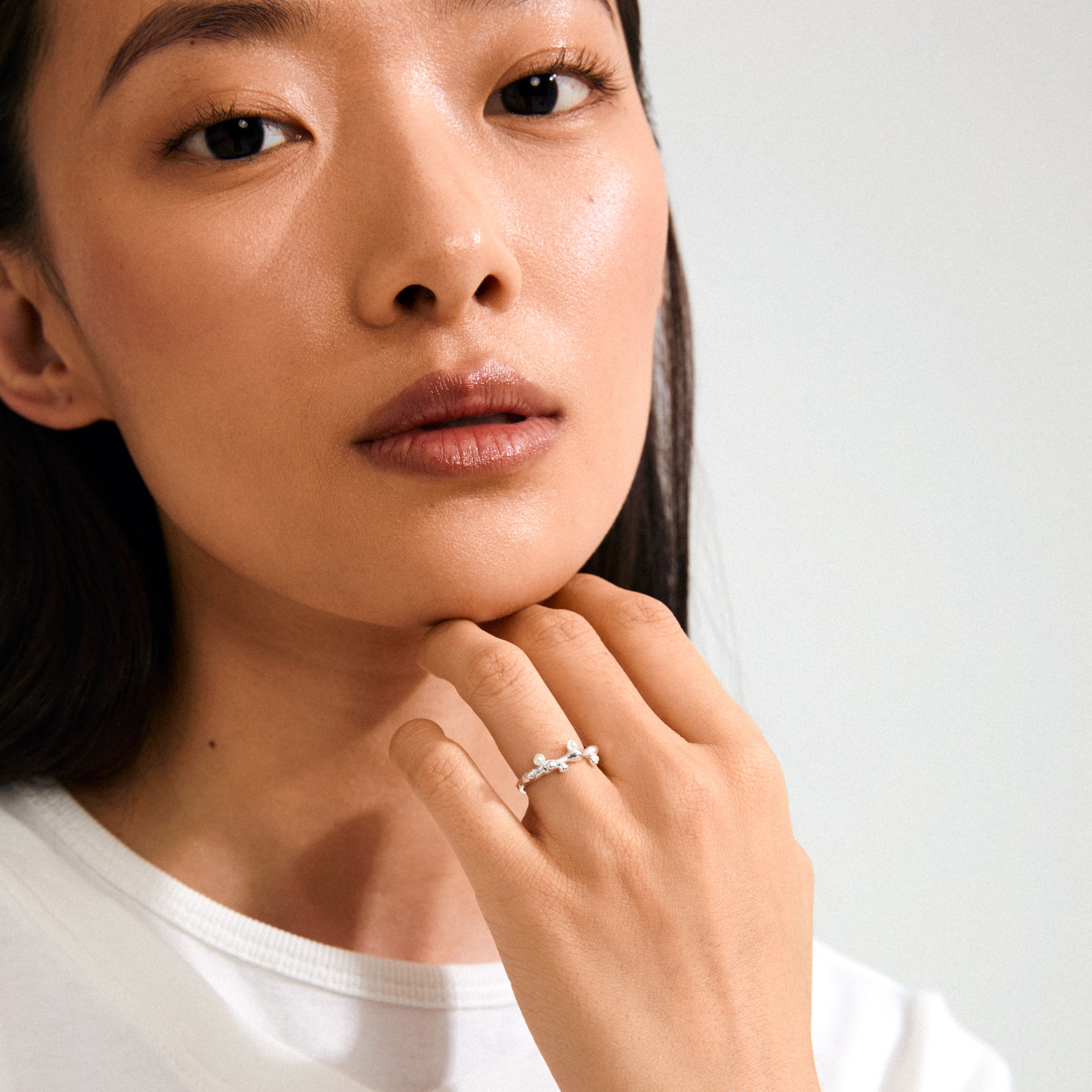 LULU magic stack ring, silver-plated, features an organic twig design with mother-of-pearl beads resembling dewdrops, crafted from 98% recycled materials for a magical, elegant touch.