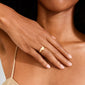 Close-up of a woman wearing Pilgrim's ARIN gold-plated signet ring with a heart design, showcasing minimalist elegance and effortless style on her ring finger.