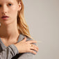 COBY crystal ring gold-plated with rectangular links and sparkling Preciosa crystals, worn by a woman. Part of Pilgrim's recycled COBY series.