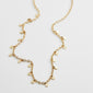 PANNA coin necklace gold-plated features small round pendants on a delicate chain, exemplifying a blend of classic and trendy Scandinavian design.