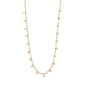 Gold-plated PANNA coin necklace with small round polished pendants along a delicate chain, inspired by classic exotic jewellery.