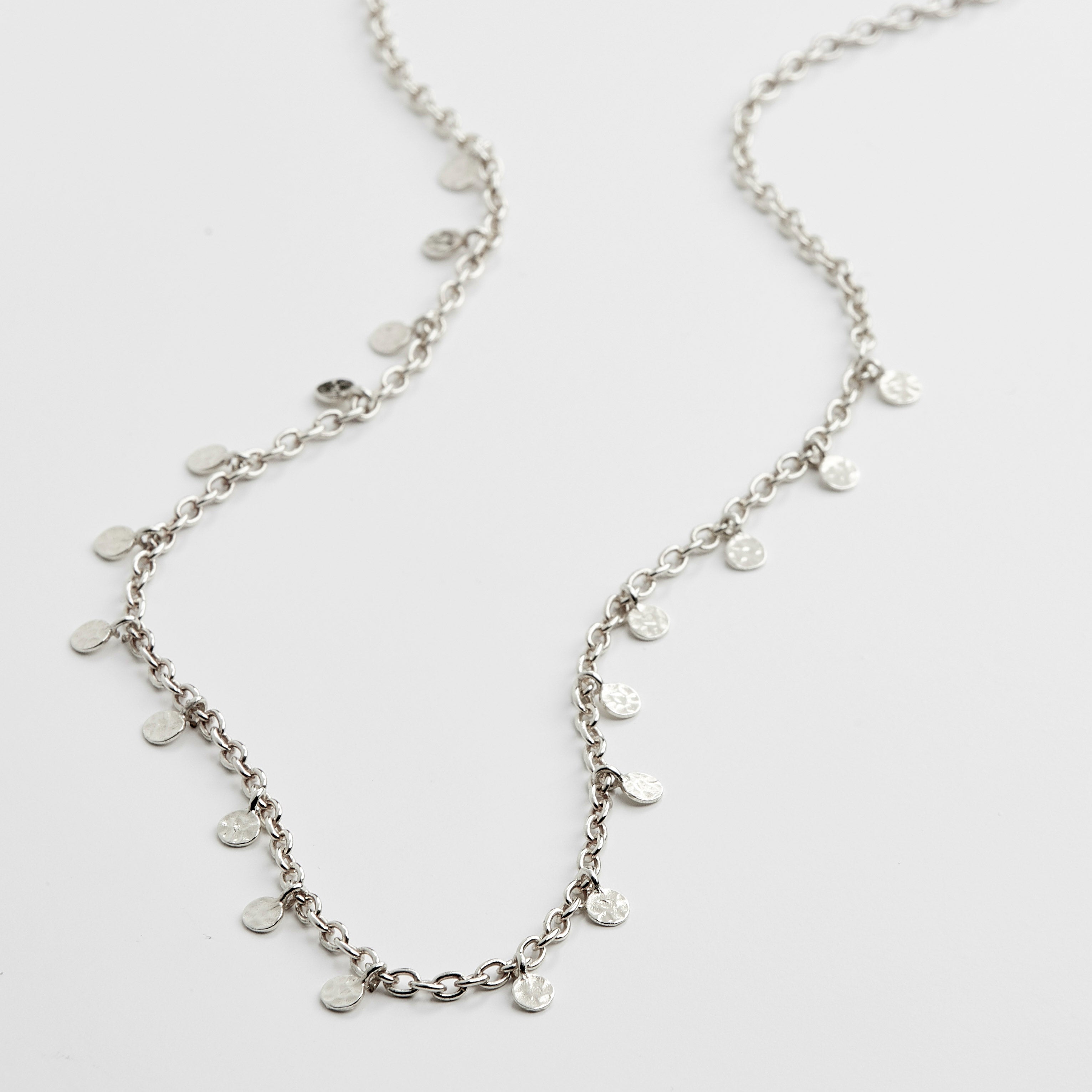PANNA coin necklace silver-plated, featuring small polished round pendants on a delicate 40 cm chain with a 9 cm extension, inspired by classic exotic jewellery.