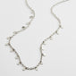 PANNA coin necklace silver-plated, featuring small polished round pendants on a delicate 40 cm chain with a 9 cm extension, inspired by classic exotic jewellery.