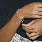 PANNA coin bracelet silver-plated, worn on a wrist, features delicate chain design with polished coins, embodying Pilgrim's blend of timeless elegance and trendy style.