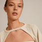 TINA crystal pendant necklace, silver-plated, on model's neck, showcasing its irregular, organic design and embedded crystal, part of Pilgrim's recycled collection.