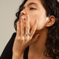 A woman showcases the TINA organic shape crystal ring, silver-plated, highlighting its elegant, handcrafted design with a sparkling Preciosa crystal.