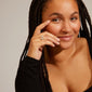 Woman with braids wearing Pilgrim's CHANTAL silver-plated ring, showcasing its glossy, organic design, perfect for both everyday and glam looks.
