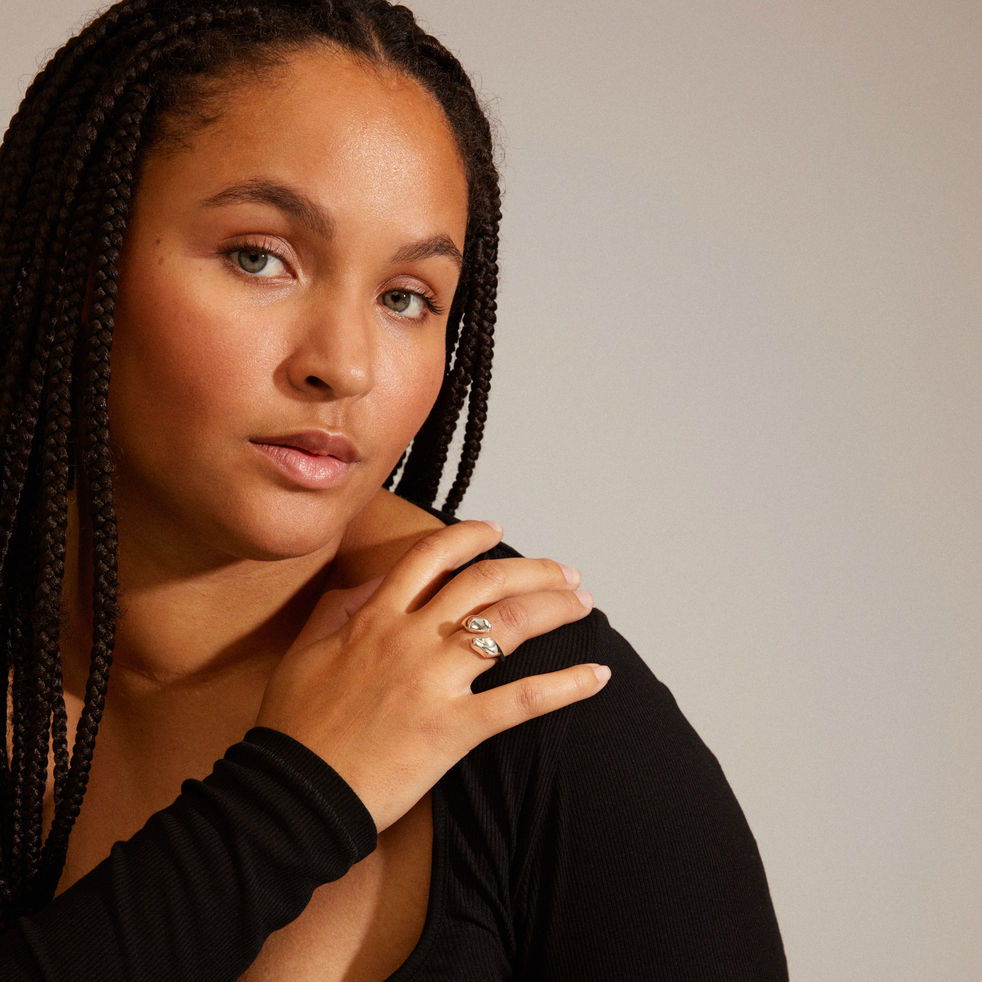 Close-up of a woman wearing the CHANTAL ring, silver-plated, showcasing its organic, handcrafted design, part of Pilgrim's recycled jewelry collection.