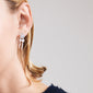 ZHURI silver-plated earrings featuring delicate floral studs and charming drop chains, offering a romantic and playful touch, perfect for everyday and special occasions.