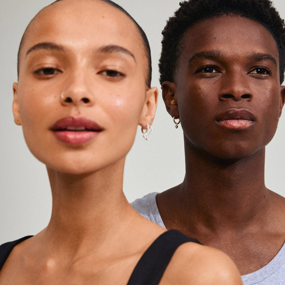JOA crystal hoop earrings, gold-plated with sparkling Preciosa crystals, feature a dangling crystal pendant. Perfect for adding subtle shine to everyday outfits.