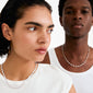 Two young models wear Pilgrim's ELIYAH silver-plated necklace, showcasing its delicate, textured links against simple white tops.