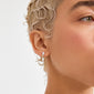 Side profile highlighting ELIYAH silver-plated drop earrings with diamond-like stones, styled with wet-look platinum-blonde waves, showcasing Pilgrim's timeless, trendy craftsmanship.