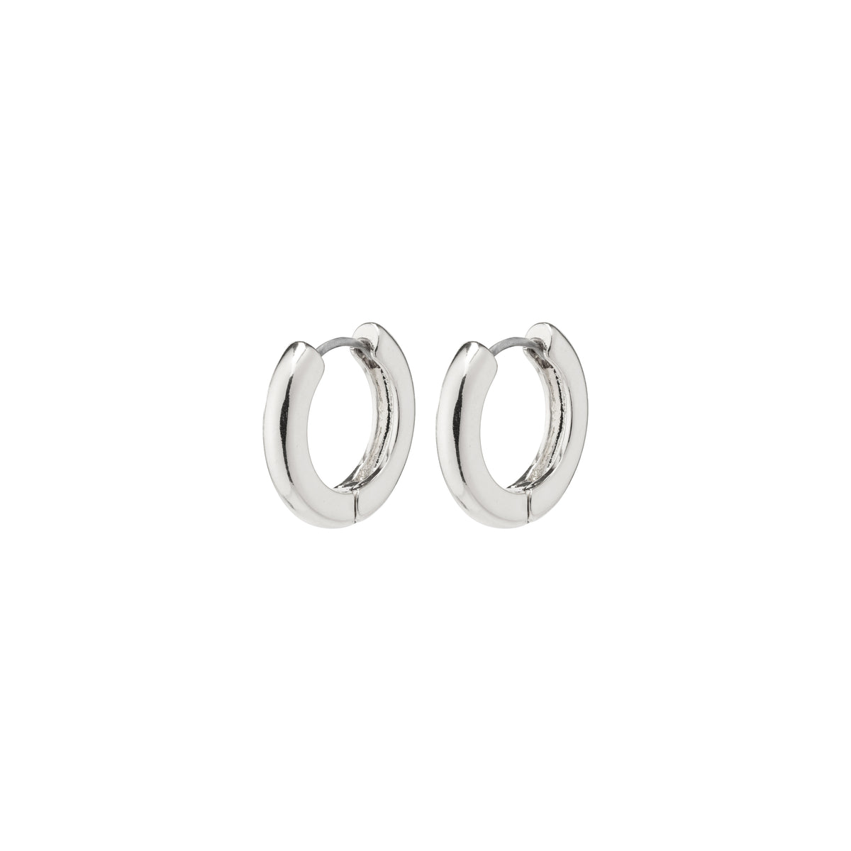 TYRA chunky hoop earrings silver-plated by Pilgrim, showcasing simple, stylish design. Made from 99% recycled materials, reflecting Scandinavian quality and environmental care.
