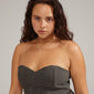 AFRODITTE heart necklace silver-plated worn by a woman in a strapless dress, showcasing the elegant heart pendant against her neck.