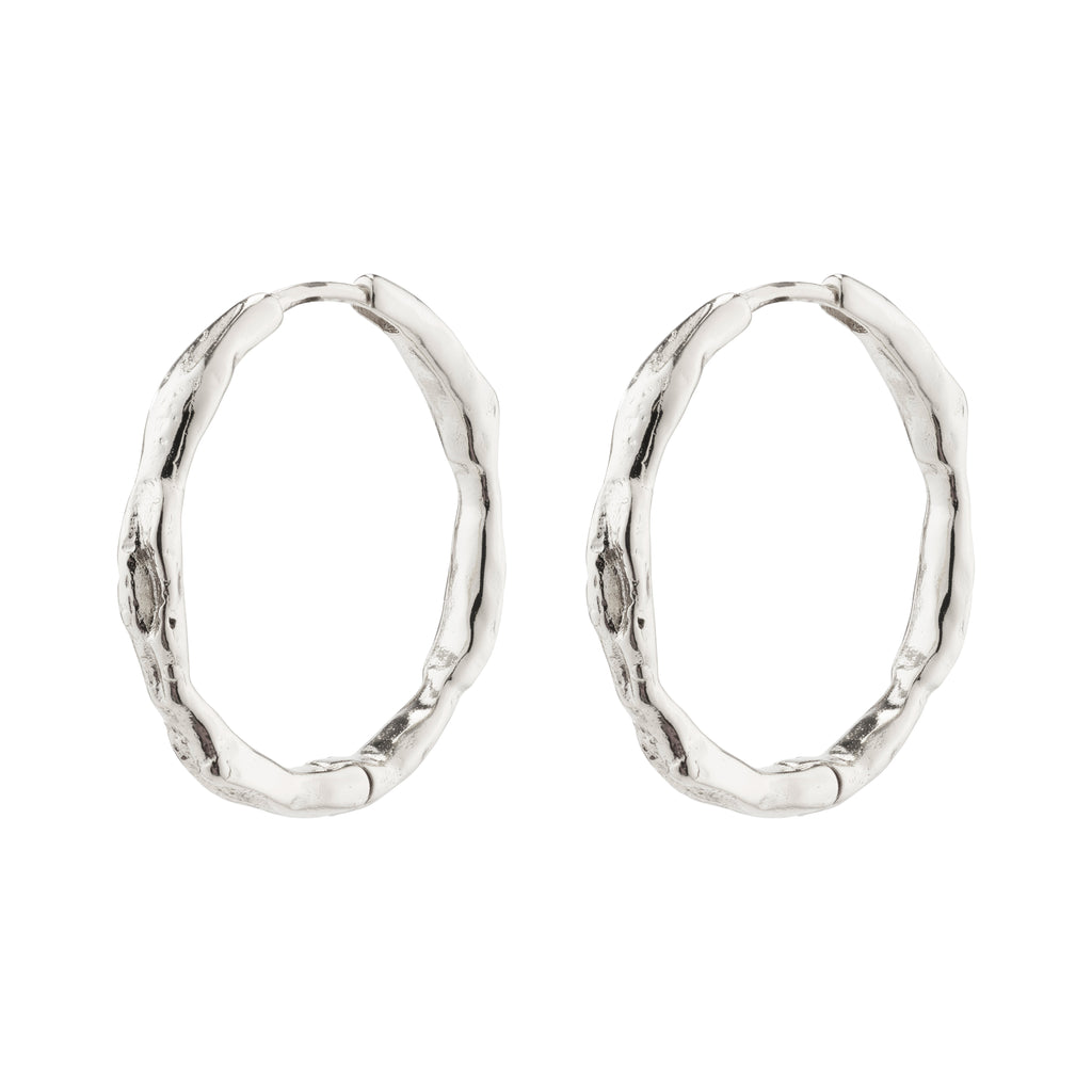 EDDY organic-shaped large silver-plated hoop earrings with a wavy, handcrafted design, perfect for adventurous, stylish individuals seeking unique, Scandinavian-inspired jewelry.