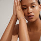 Woman wearing ROGUE crystal halo bracelet silver-plated, hands elegantly together, showcasing its sparkling Preciosa crystals, emphasizing Pilgrim's trendy and timeless Danish jewelry style.