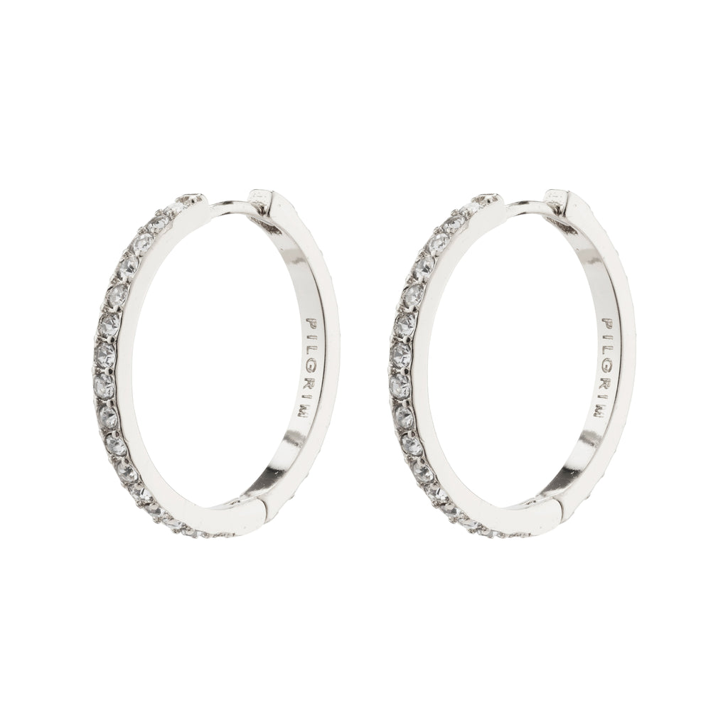 EBNA large crystal hoops silver-plated, featuring Preciosa crystals, offer sparkle and glam with a smart click lock, perfectly aligning with Pilgrim's trendy, inclusive style.