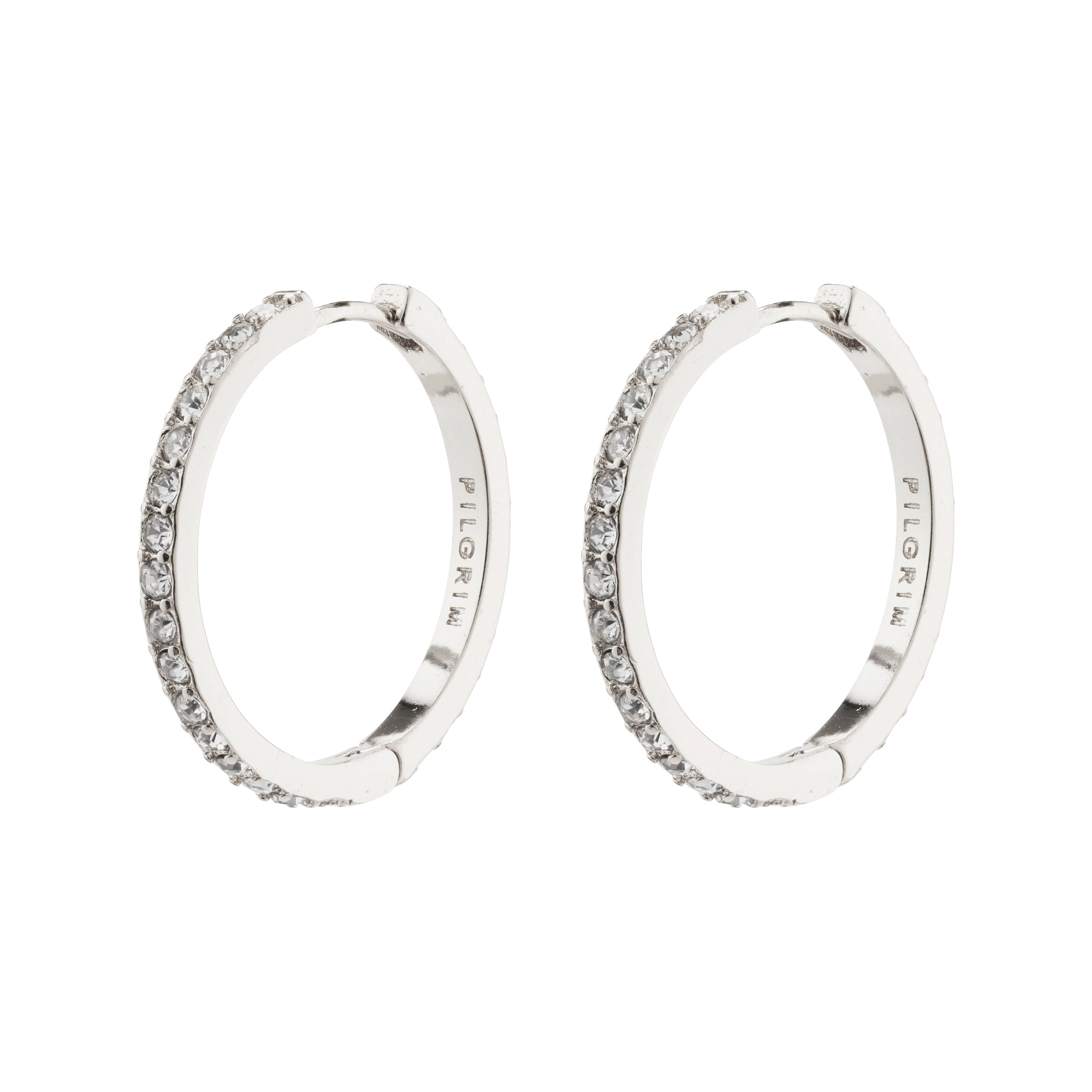 EBNA large crystal hoops silver-plated, featuring Preciosa crystals, offer sparkle and glam with a smart click lock, perfectly aligning with Pilgrim's trendy, inclusive style.