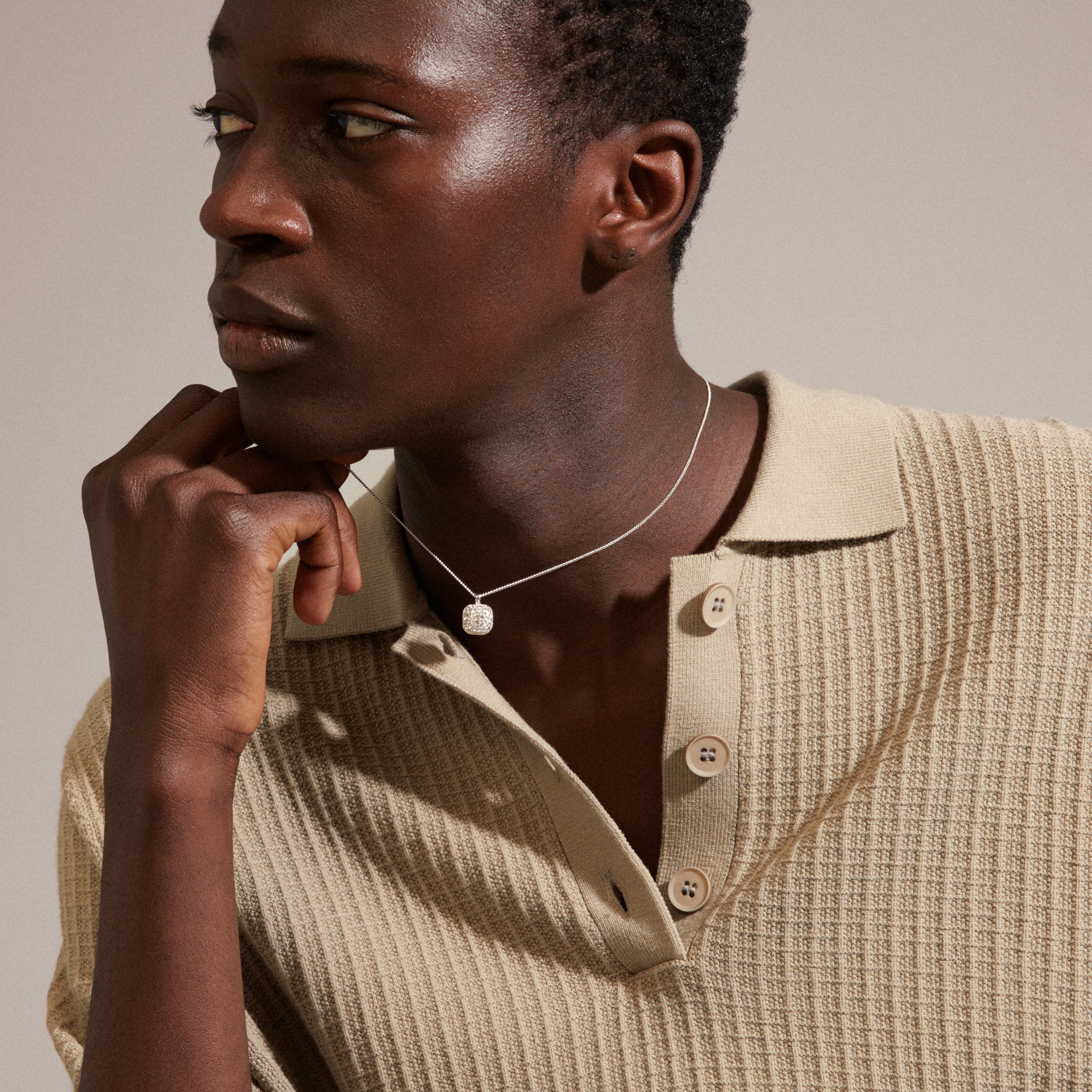 Man wearing Pilgrim's CINDY crystal pendant necklace, silver-plated with sparkling Preciosa crystals, showcasing the stylish and elegant design.