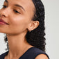 KLEOPRATRA earrings gold-plated with colorful Preciosa crystals, worn by a woman with curly hair, showcasing elegance and sustainable style.