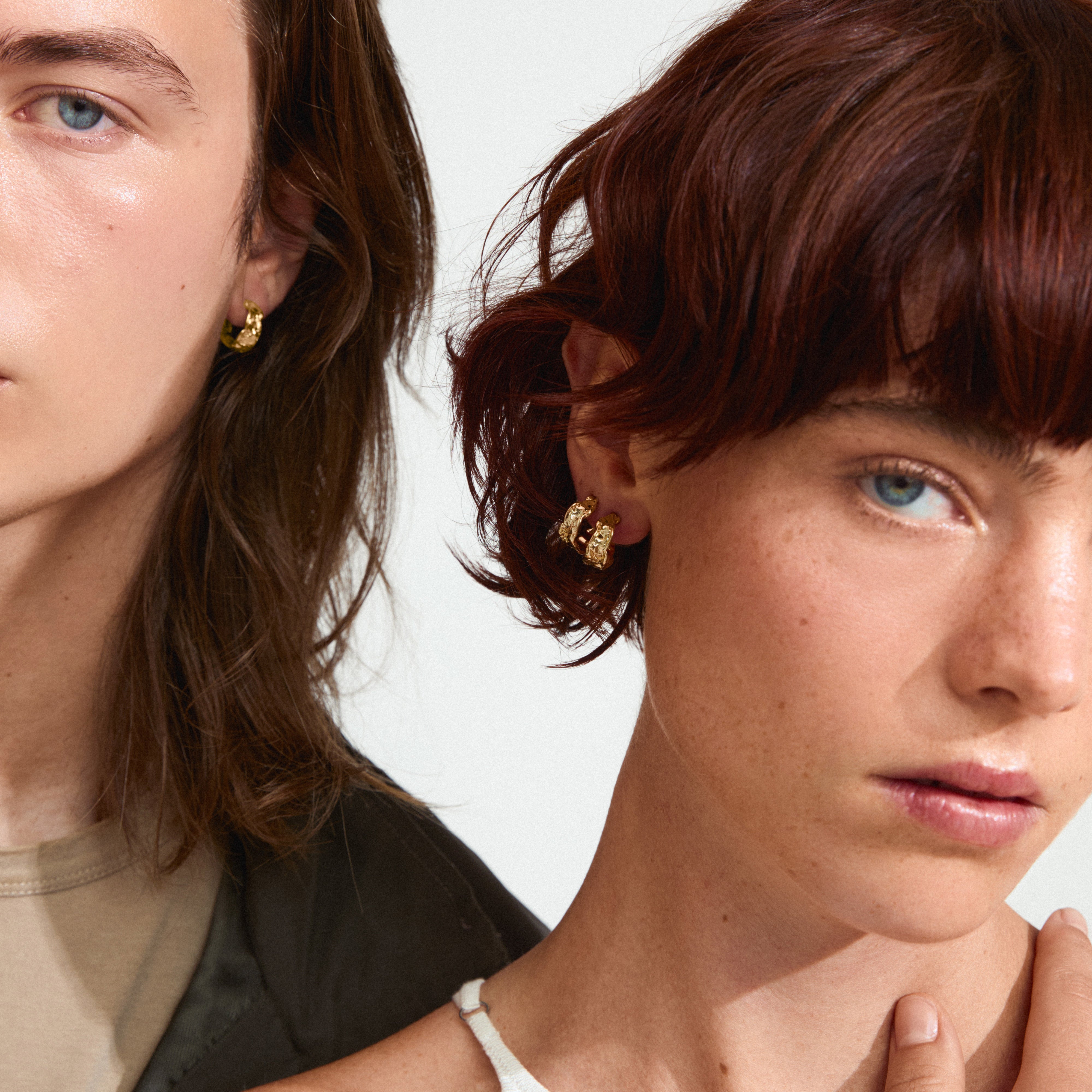 Man and woman showcasing ELARA gold-plated earrings, highlighting their rustic, classy, and handcrafted design by Pilgrim, with an empowering and trendy aesthetic.