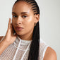 LARISA gold-plated earrings with a twisted silhouette, worn by a woman with braided hair, embodying a luxurious boho style.