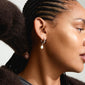 JONNE pearl earrings, 2-in-1 set, silver-plated, featuring freshwater pearls on hoops and classic studs, worn by a woman with braided hair.