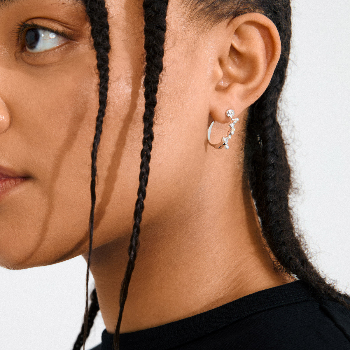 HADLEY earrings, silver-plated semi hoops with organic bubble and pearlescent bead design, embodying morning dew's essence. Crafted from 95% recycled materials for a mindful style.