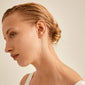Close-up of a woman wearing Pilgrim's KAMARI silver-plated crystal chain earrings, showcasing their elegance and discreet charm for life’s special moments.