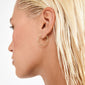 Side profile of a person wearing EANNA large gold-plated hoop earring, showcasing its elegant design and recycled material composition.