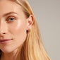 DESIREE gold-plated hoop and cuff earrings showcased on a woman's ear, featuring a unique chain design with cubes and round links for a trendy look.