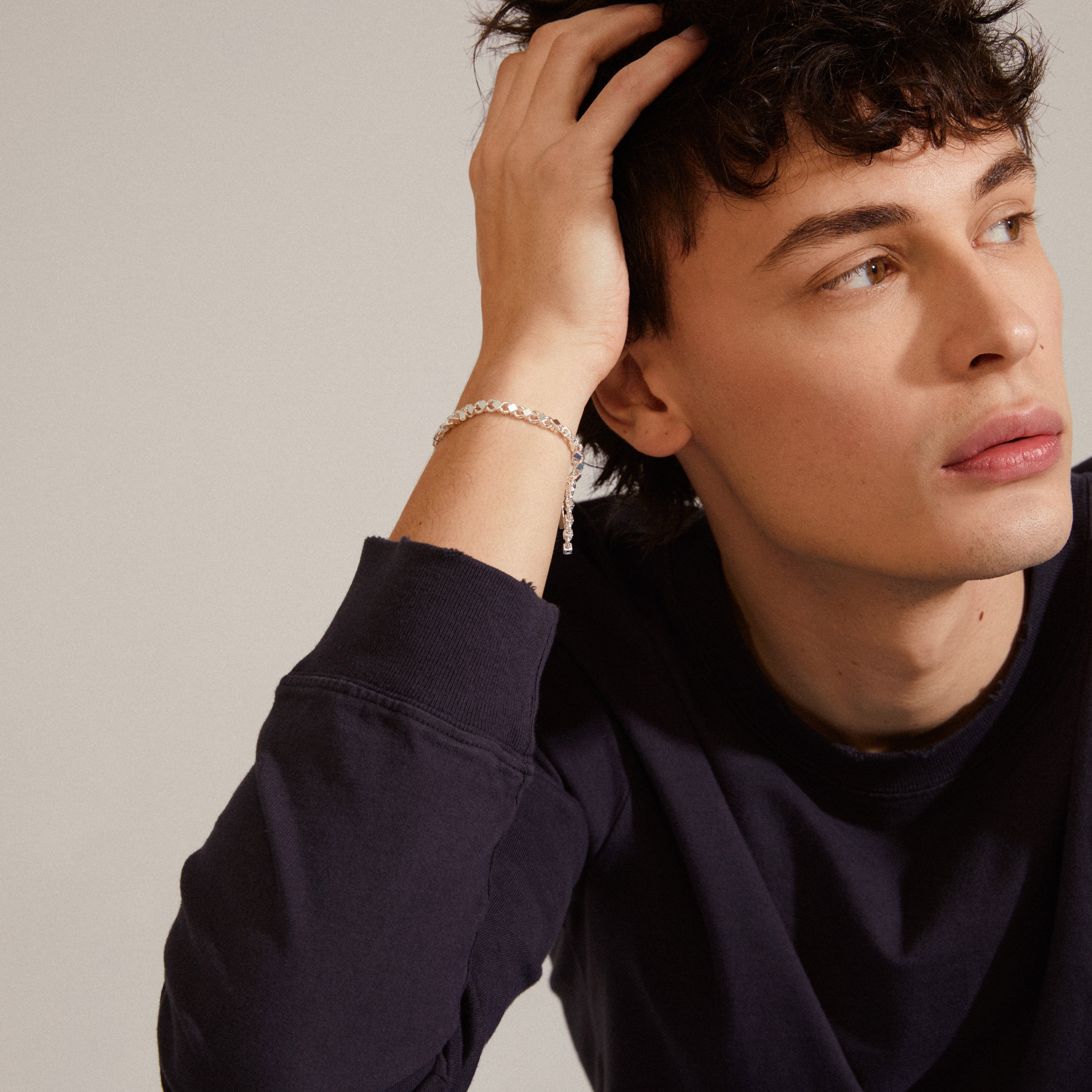 Silver-plated DESIREE bracelet on a man's wrist, showcasing Pilgrim's recycled, stylish design ideal for everyday and urban glam looks.
