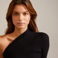 DESIREE hoop and cuff earrings in silver-plated design, showcasing a unique chain of cubes and round links, worn by a woman in a black dress.