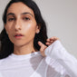 INAYA earrings silver-plated, featuring abstract seashell design with white bead center, crafted from recycled materials. Ideal for versatile styling and multiple piercings.