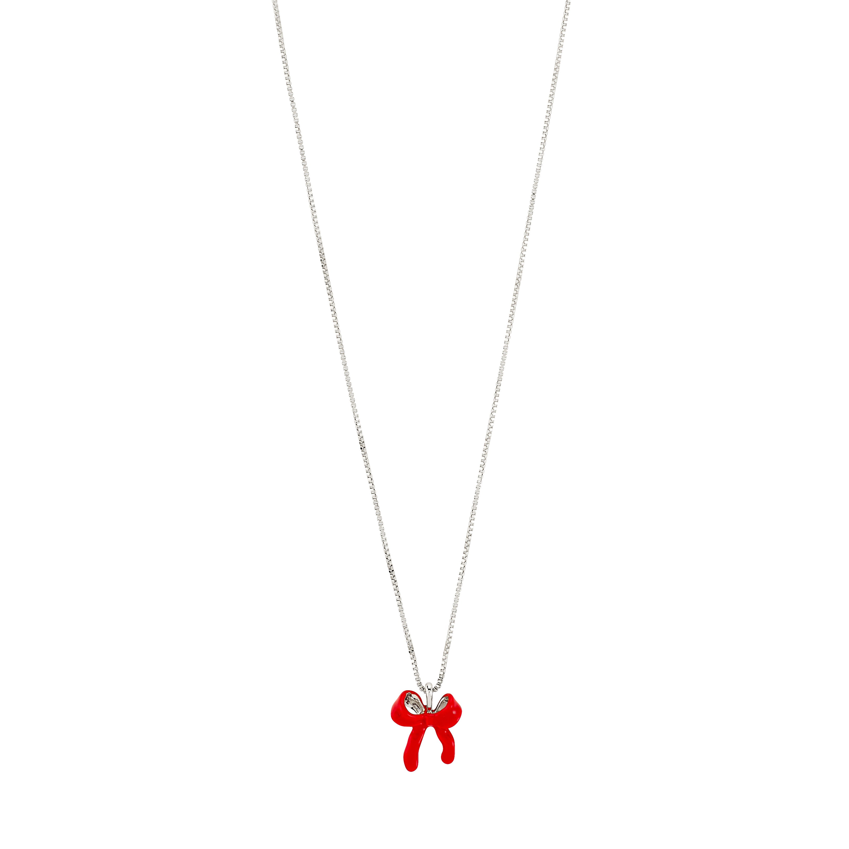 SIGRUN necklace features a silver-plated chain with a playful red enamel bow pendant, offering adjustable length for versatile styling. Crafted from 97% recycled materials.