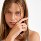 Young woman wearing the SIGRUN ring silver-plated, featuring a small red bow, highlighting personal style with Pilgrim’s playful, adjustable, and eco-friendly accessory.