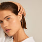 EIRA cable chain hoop earrings, silver-plated, worn by a woman with sleek hair, highlighting the earrings' delicate, minimalist design and cool urban aesthetic.