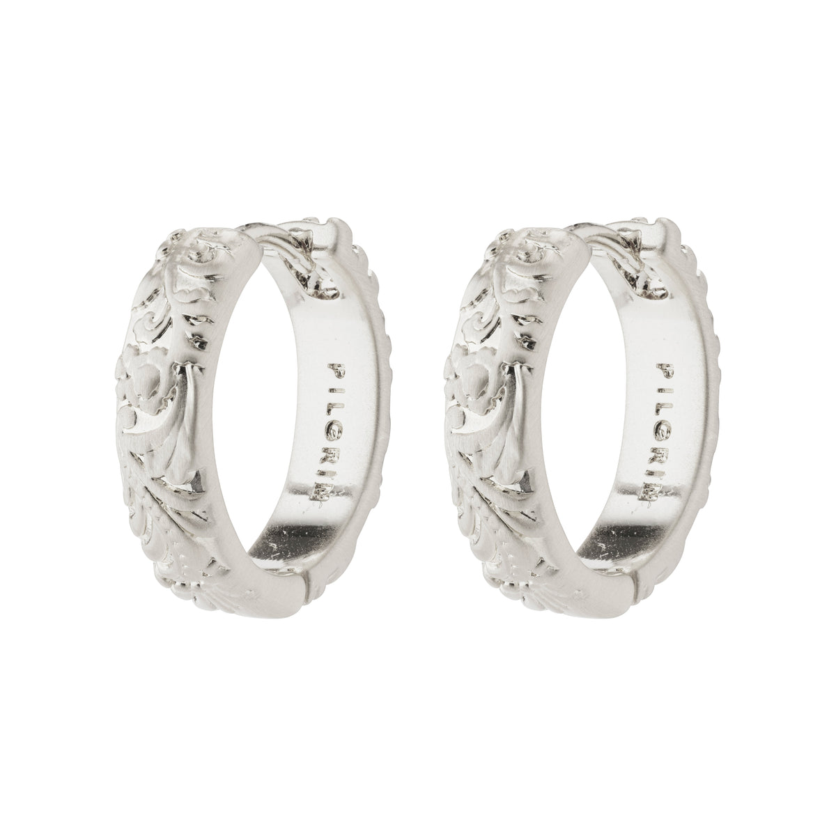 ELFRIDA hoop earrings silver-plated with nature-inspired carvings of flowers and leaves, featuring a satin-matte finish and convenient click lock closure.
