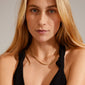 DOMINIQUE necklace gold-plated: Close-up of a gold-plated snake chain necklace worn by a woman, showcasing the elegant design from Pilgrim's DOMINIQUE collection.