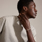 Close-up of a man wearing the DOMINIQUE silver-plated bracelet with a square snake design, highlighting its shiny, genderless style from Pilgrim's collection.