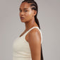 Woman with braided hair wearing gold-plated IRENE earrings & cuff 5-in-1 set, showcasing asymmetrical ear studs, cuffs, and hoops for a stylish, curated look.