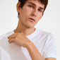 Young man wearing the DAGMAR bracelet silver-plated, featuring a dainty flower charm with sparkling stones, highlighting its classic elegance and historical significance.