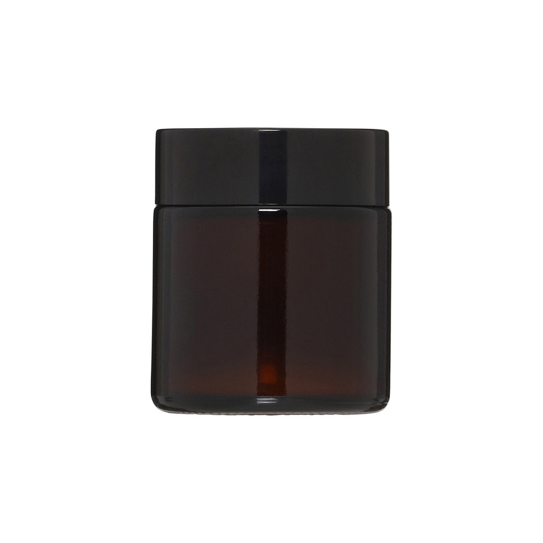 PILGRIM Scented candle in brown, crafted from sustainable rapeseed wax with a sandalwood fragrance, features a cotton wick for a serene, eco-friendly burn.