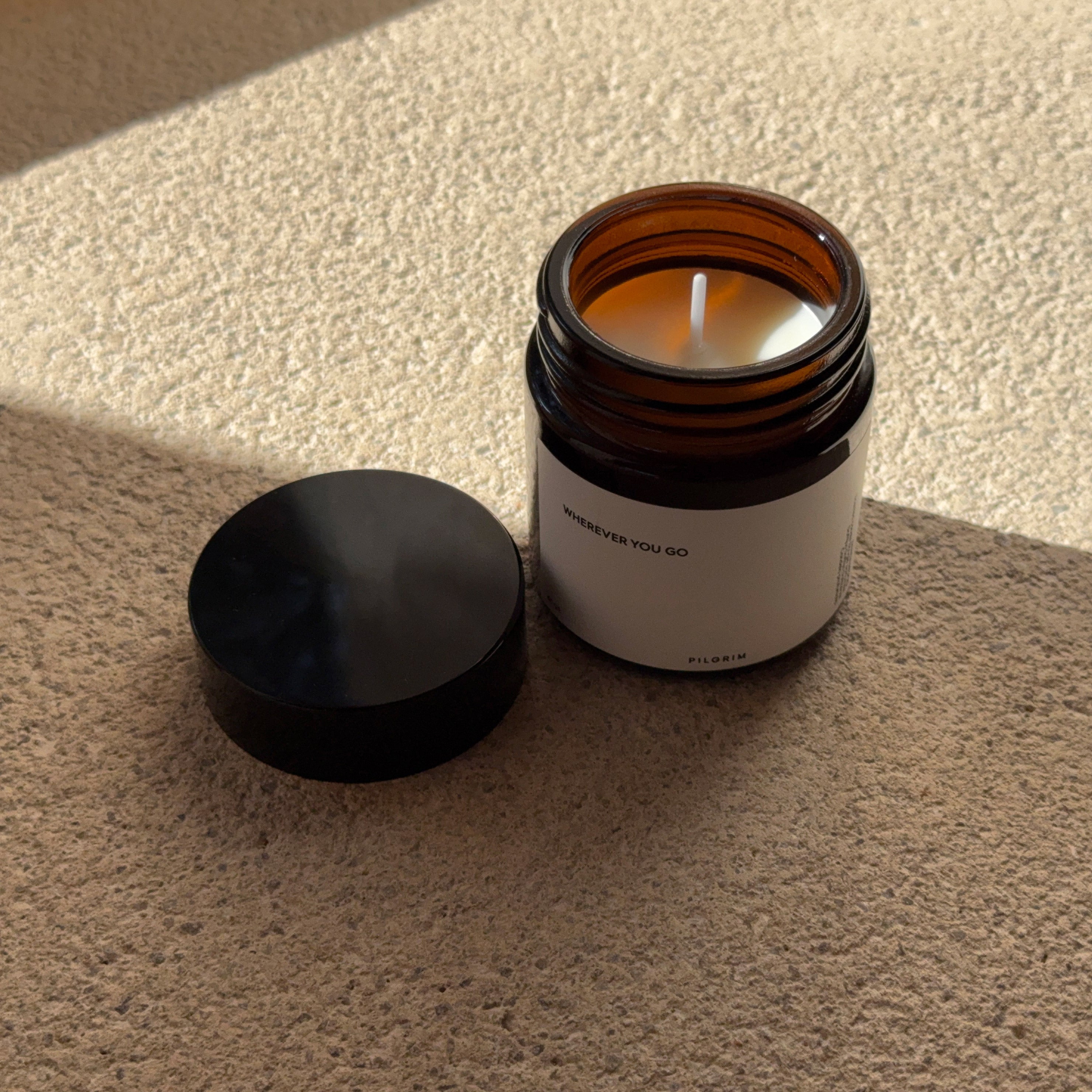 PILGRIM Scented candle in a jar, featuring a Sandalwood fragrance, crafted from sustainable rapeseed wax with a cotton wick for a serene burn.