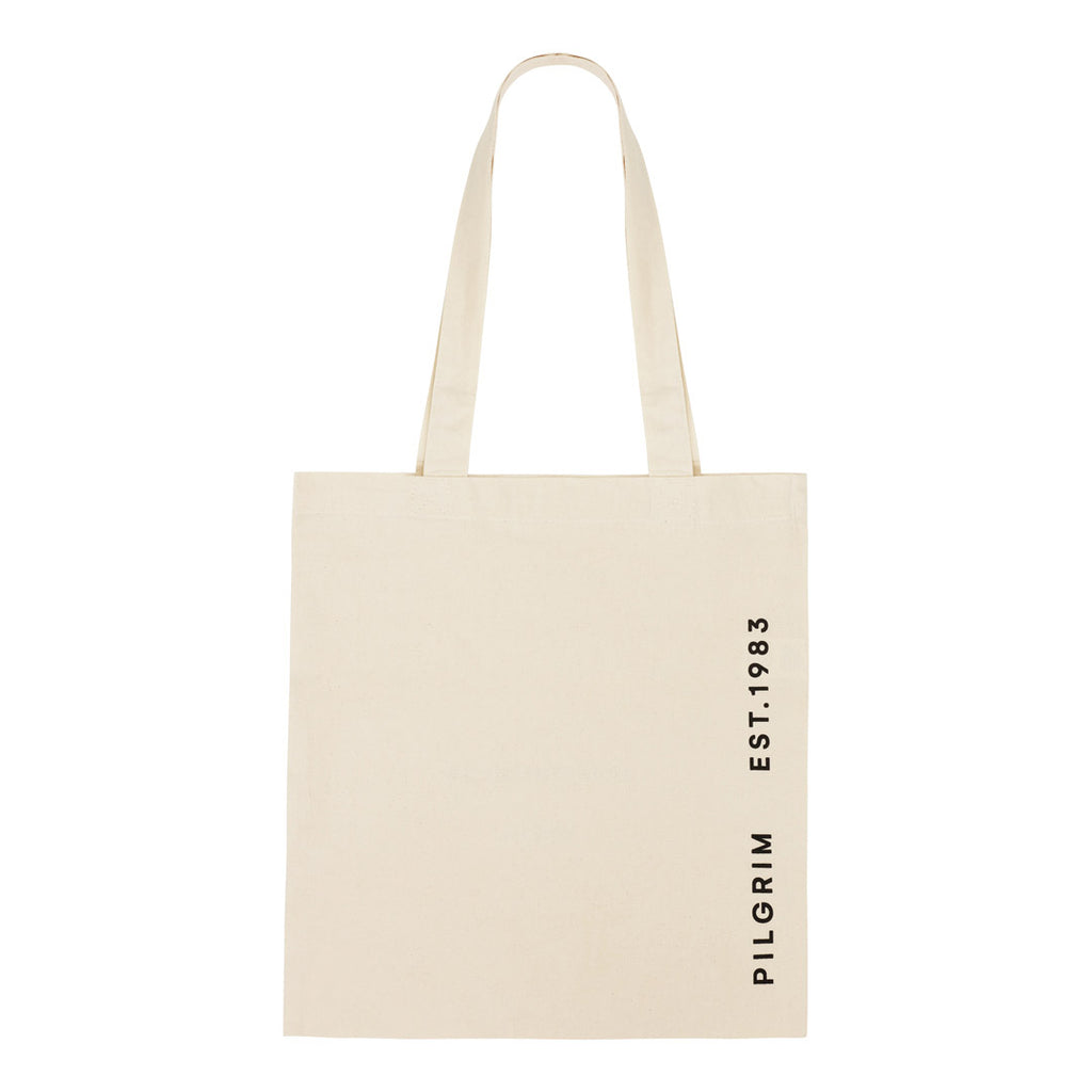Fashion canvas tote-bag in off-white organic cotton, featuring wherever you go print. Spacious with a long strap for comfortable carrying.
