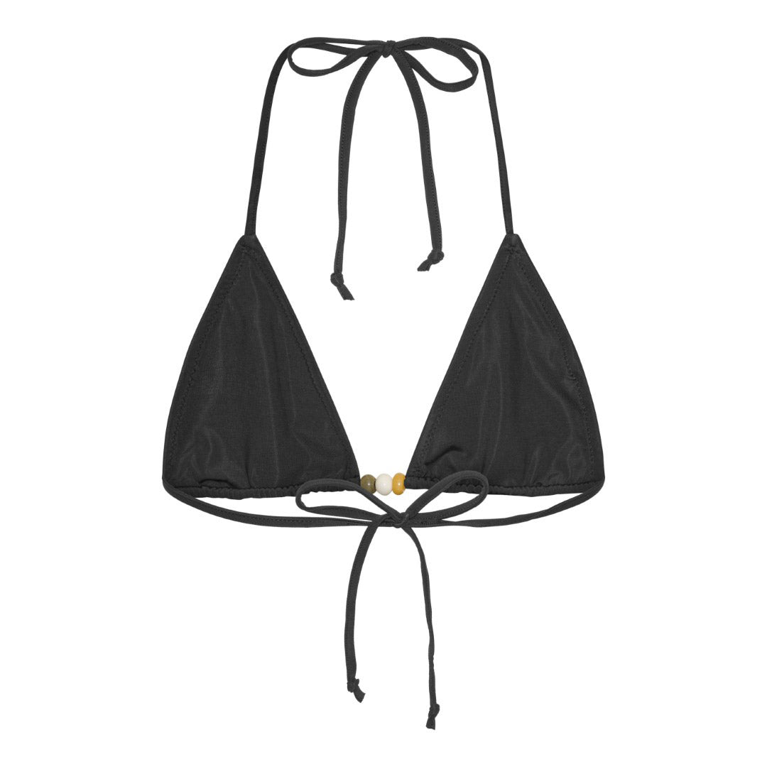 Pilgrim's black bikini in XS/S, featuring a triangle top with earthy beaded straps and high-cut bottoms, embodies effortless boho chic style for spontaneous summer adventures.
