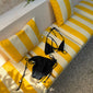 Black bikini, XS/S, with triangle top, chunky beads, high-cut bottoms, and side ties, packed in a sleek drawstring pouch for effortless style and beach readiness.
